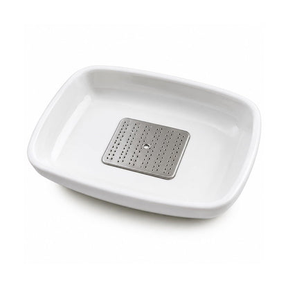 Wukusy garlic ginger grater plate for quick, mess-free food prep, showing the stainless steel surface with grated garlic and ginger.