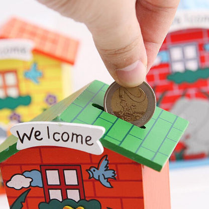 Wooden piggy bank in the shape of a cartoon house, Wukusy brand, with colorful windows and a cheerful design for saving coins.