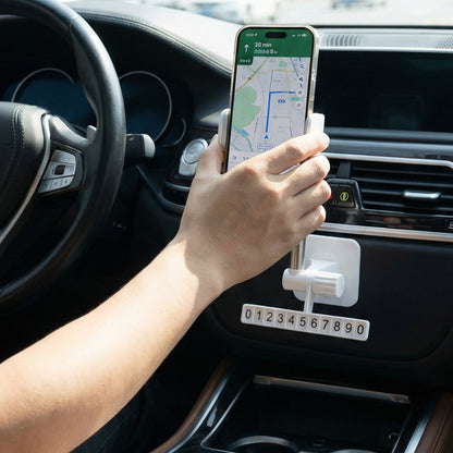 Wukusy adjustable car dashboard mobile phone holder with secure grip, mounted on dashboard, holding a smartphone in landscape orientation.