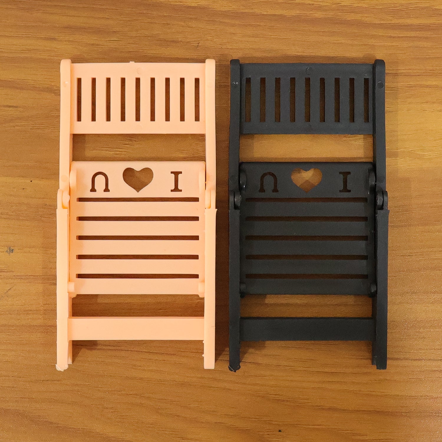 Wukusy mini chair-shaped mobile stand holder for smartphones, compact and decorative, shown in black on a white background.