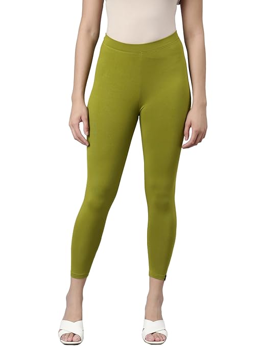Olive green skinny fit high ankle length leggings by FIZZI SHOP, close-up of fitted, stretchy fabric on model.