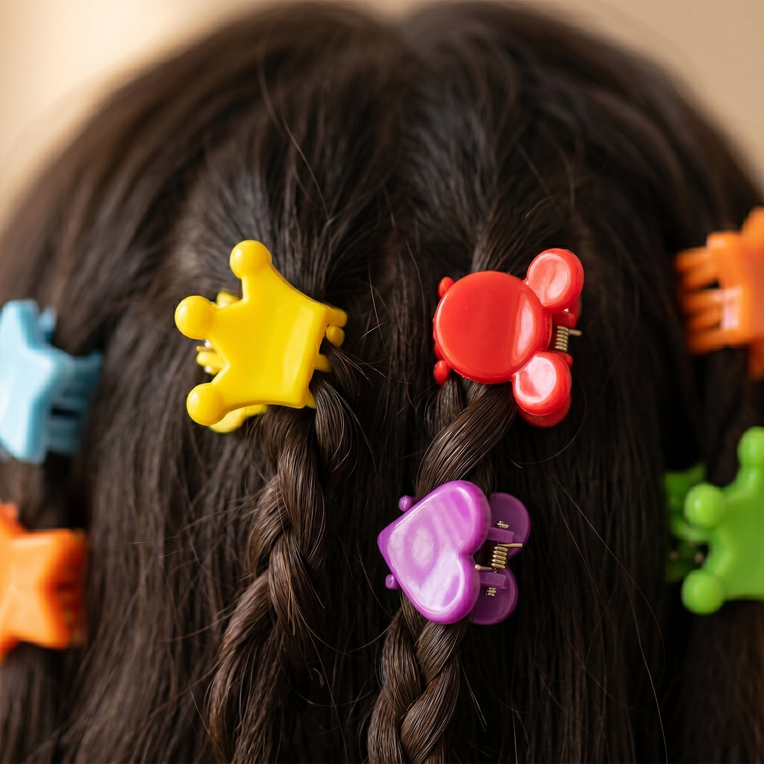 Set of colorful mini hair claw clips by Wukusy, showing vibrant plastic clips for securing small sections of hair.