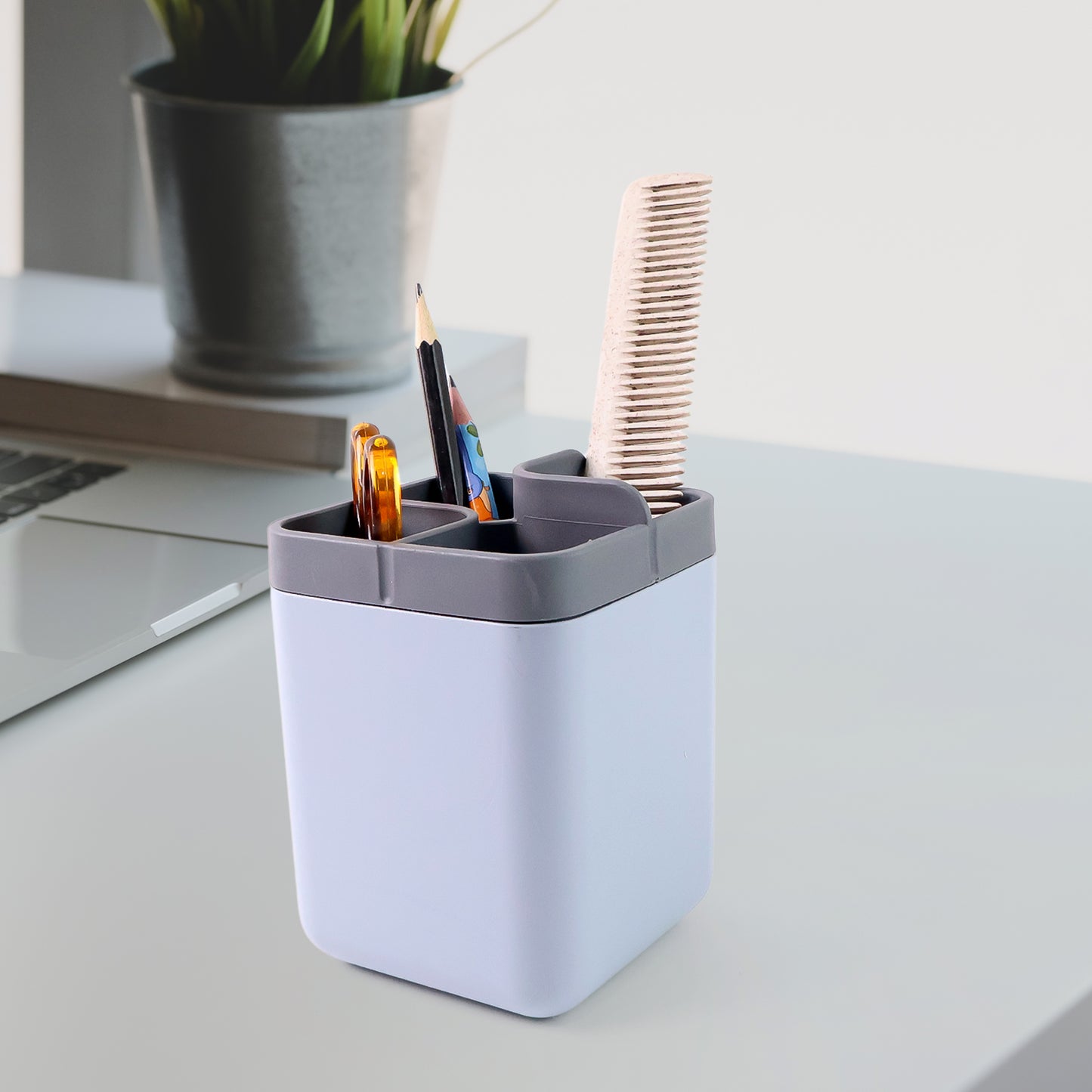 Wukusy multi-compartment desk organizer utility holder with several sections for office supplies on a workspace.