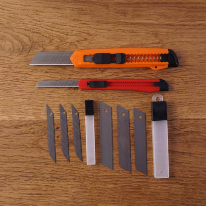 Wukusy utility knife set with durable blades for precise cutting, shown with multiple knives and blades on a plain background.