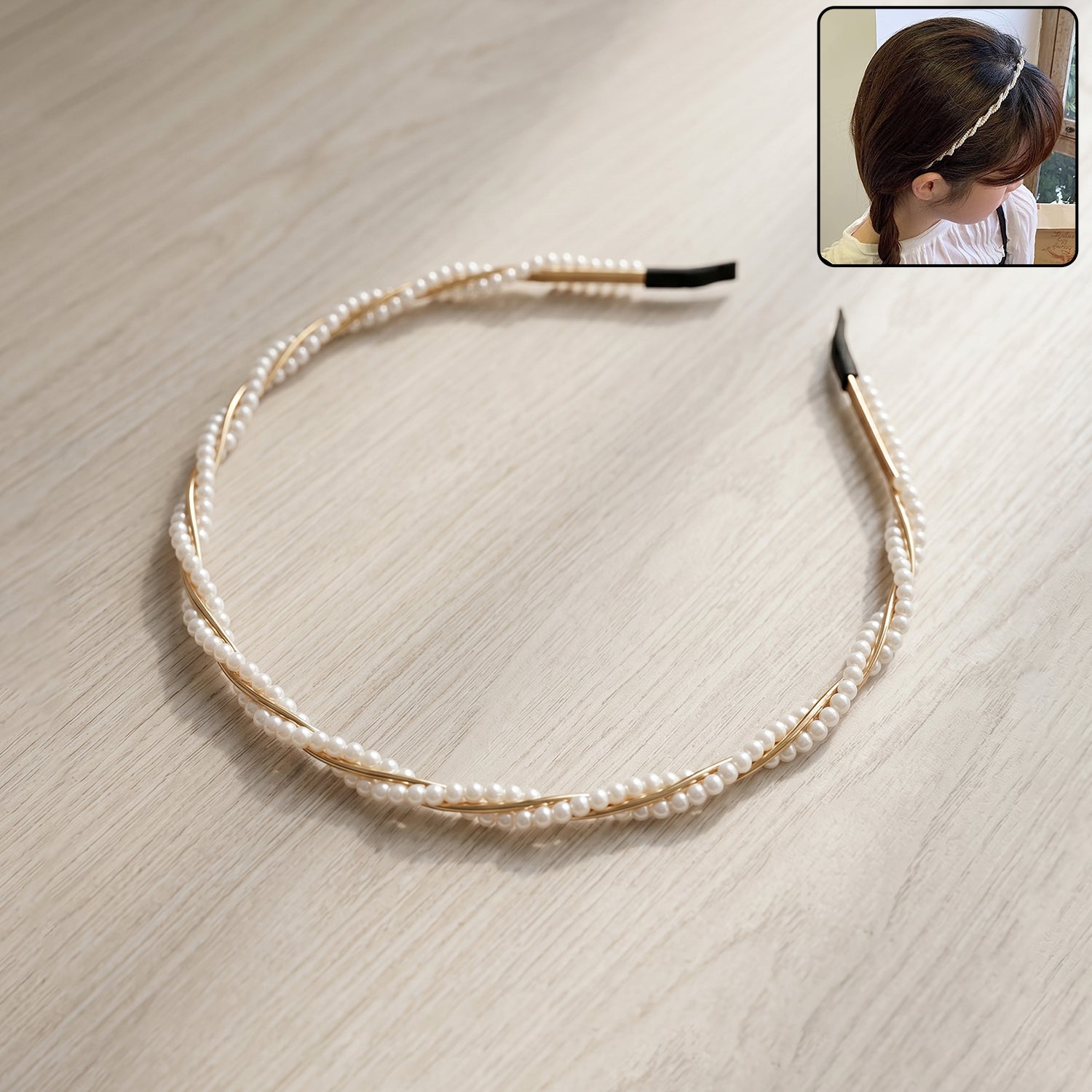 Elegant pearl design Wukusy hairband featuring a row of white pearls on a sleek headband for a sophisticated look.
