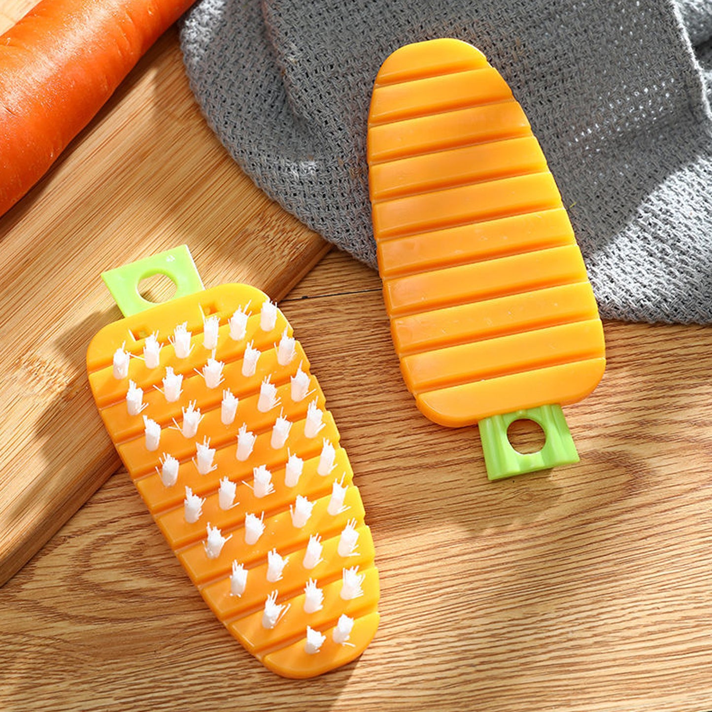 Wukusy carrot-shaped vegetable scrubbing brush for cleaning potatoes, vegetables, and fruits with non-toxic, durable bristles.