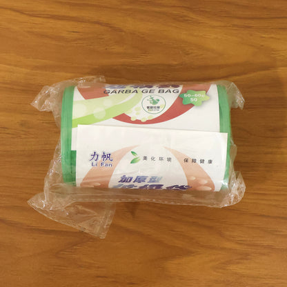 Green heavy-duty garbage bags roll with 50 eco-friendly waste disposal bags, size 50x60 cm, by Wukusy.