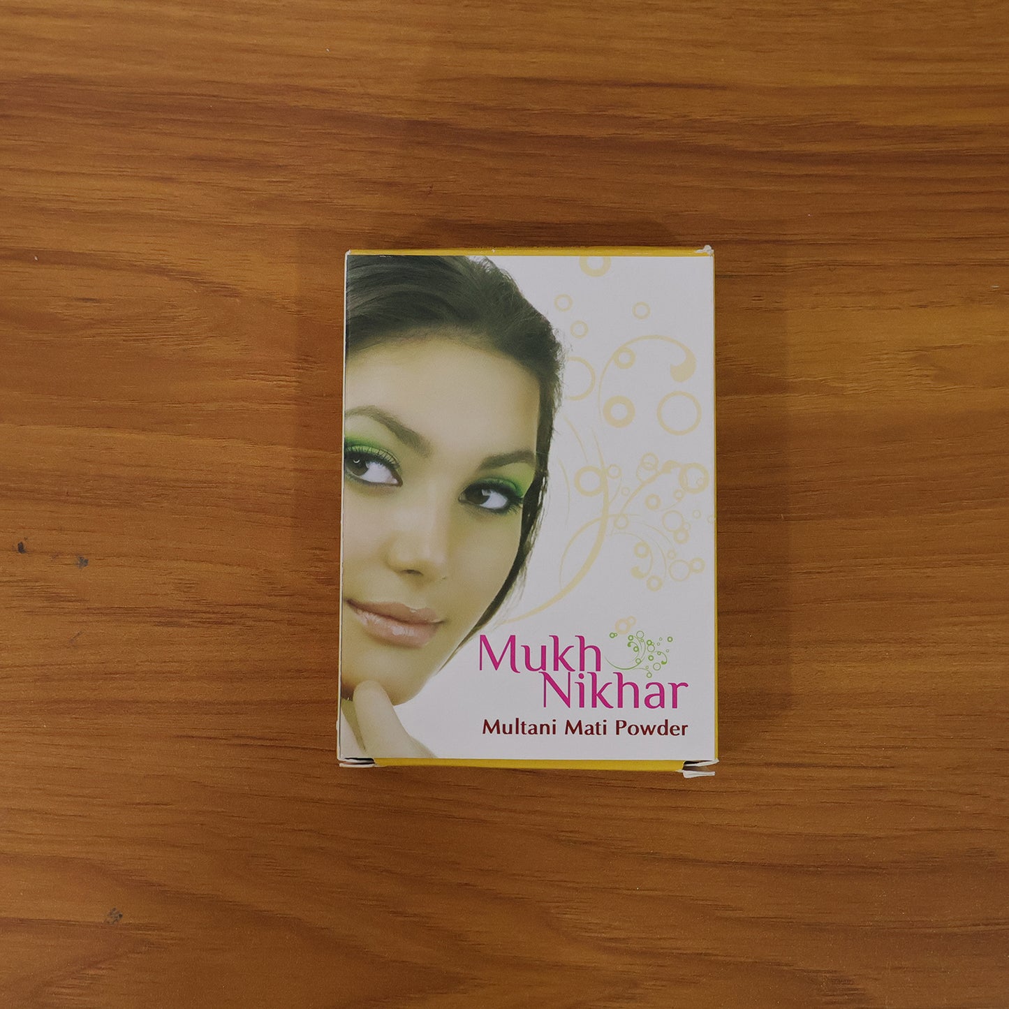 Wukusy Mukh Nikhar Multani Mati Powder, 100g, in a small container, showcasing the natural mineral powder for skincare.
