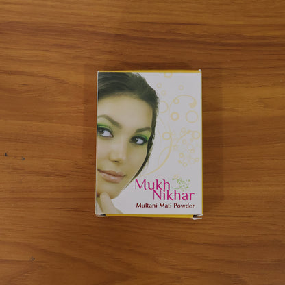 Wukusy Mukh Nikhar Multani Mati Powder, 100g, in a small container, showcasing the natural mineral powder for skincare.