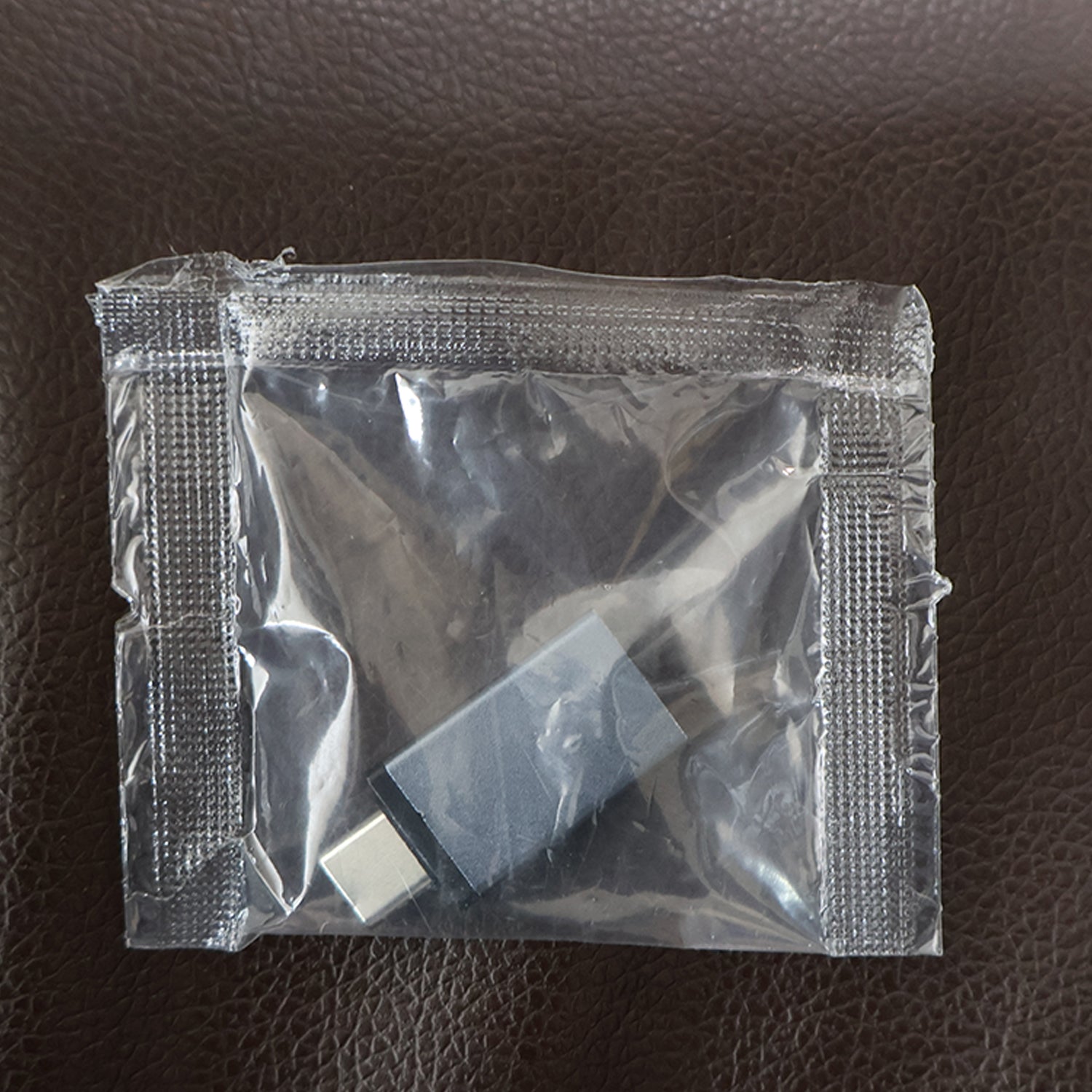 Wukusy Type-C OTG adapter pen drive connected to a device, compact black USB-C flash drive for data transfer and storage.