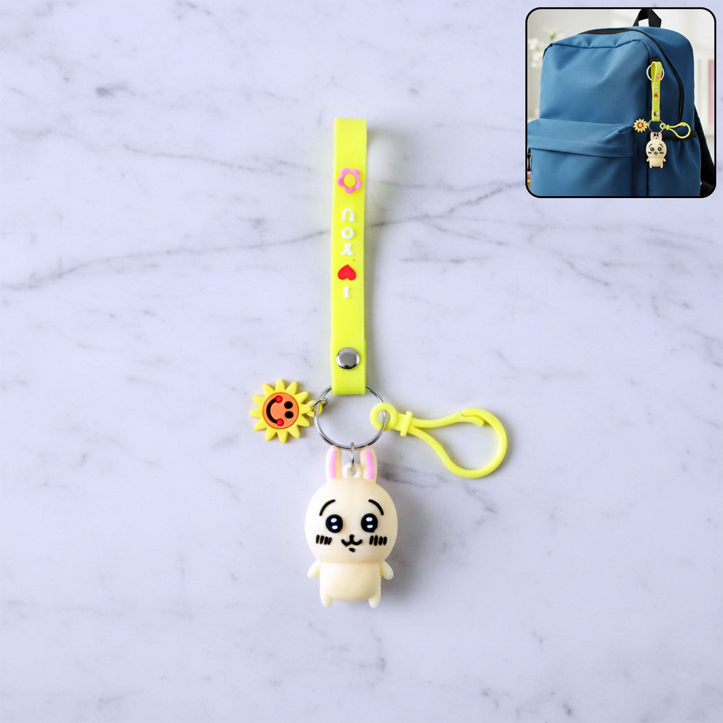 Cute cartoon bunny silicone keychain with decorative strap by Wukusy, featuring a adorable bunny design and vibrant colors.