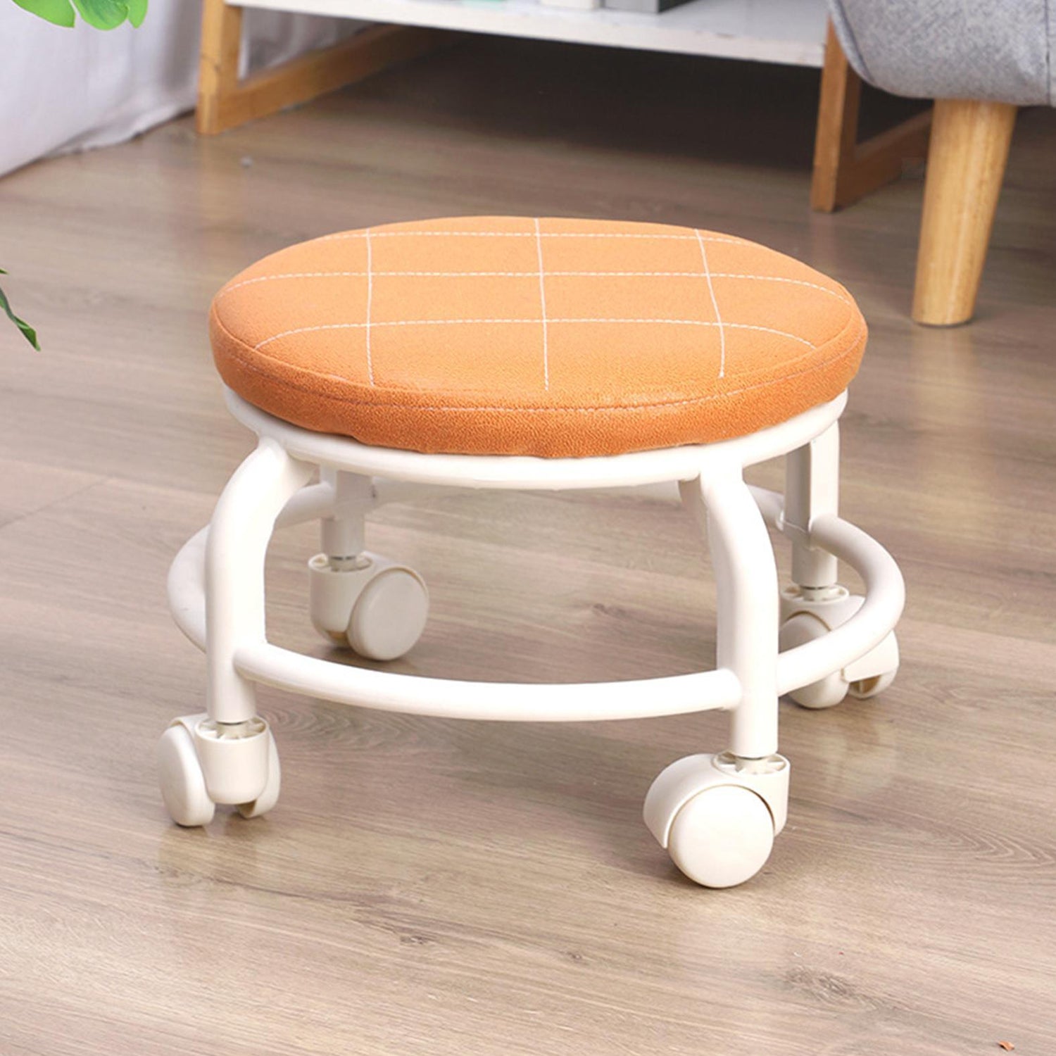 Wukusy roller seat stool with low height, movable design, small size, and pulley wheels suitable for garage, home, or library use.