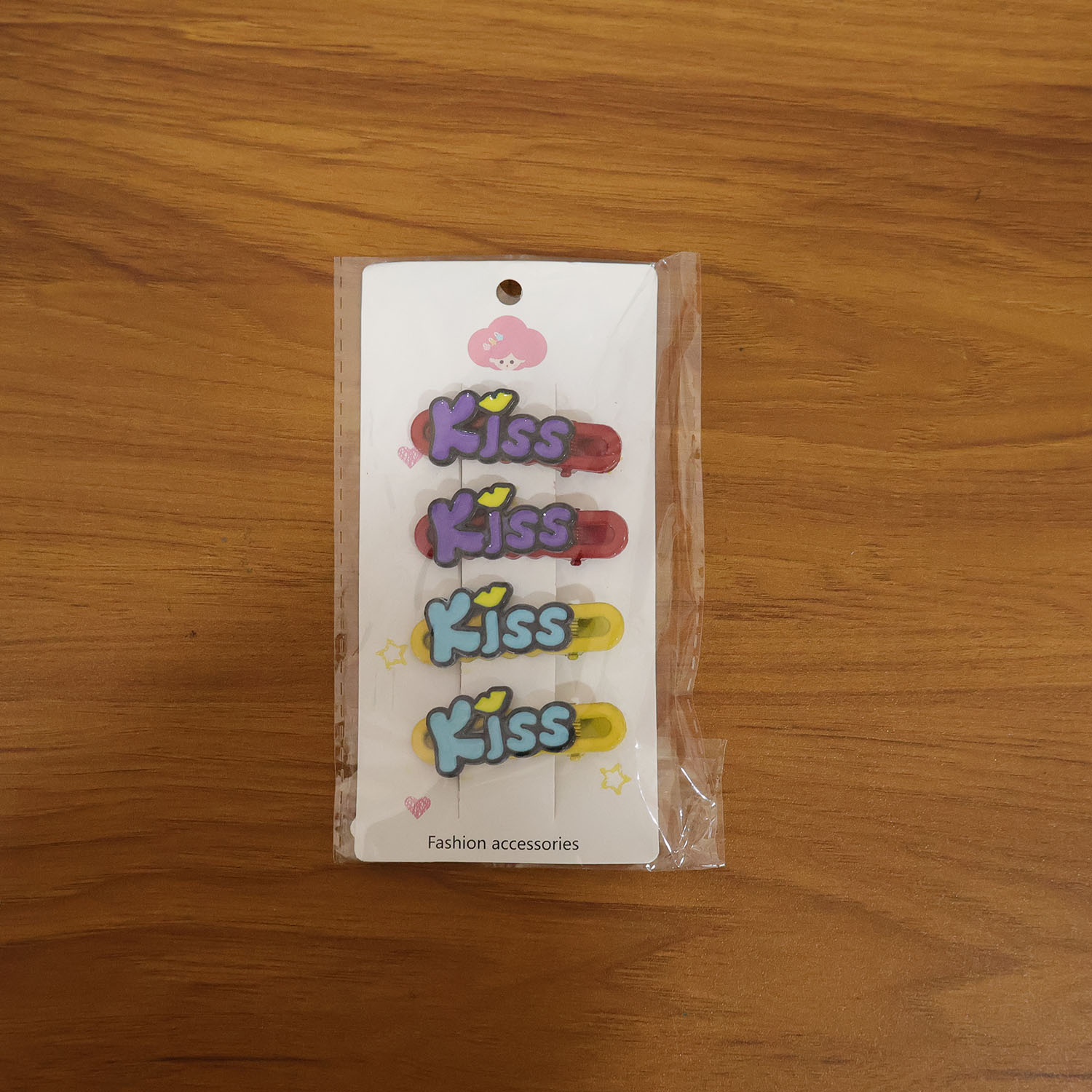 Wukusy decorative kiss text hair clip set with four fashionable hair accessories featuring kiss and text designs.