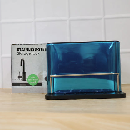 Wukusy stainless steel sink caddy organizer rack holding kitchen sponge and scrub brush in a modern kitchen setting