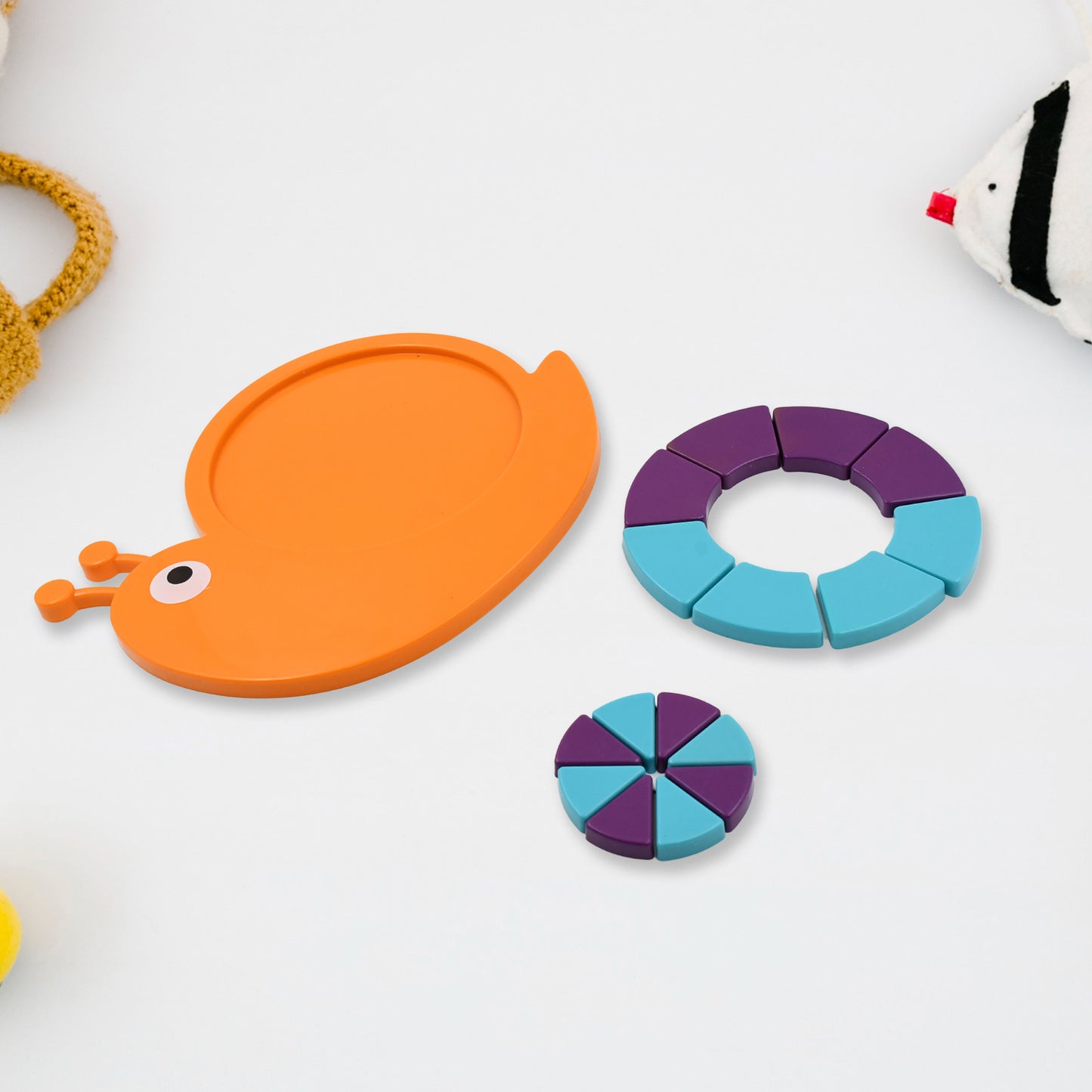 Colorful Wukusy snail puzzle toy for kids, featuring building blocks that develop motor skills and reasoning for ages 3-6.
