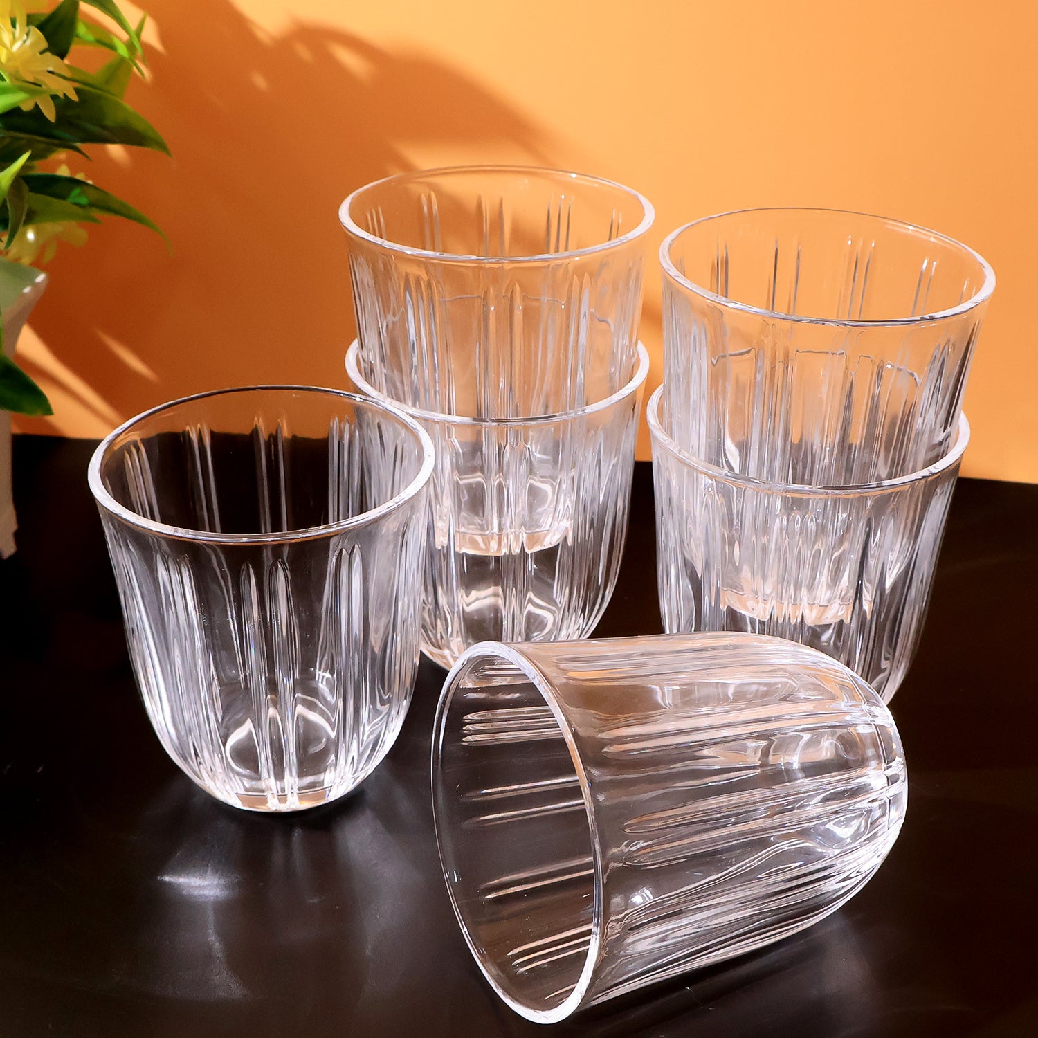 Six clear glass tumblers from Wukusy, 256ml capacity, perfect for home and kitchen use, arranged on a table.