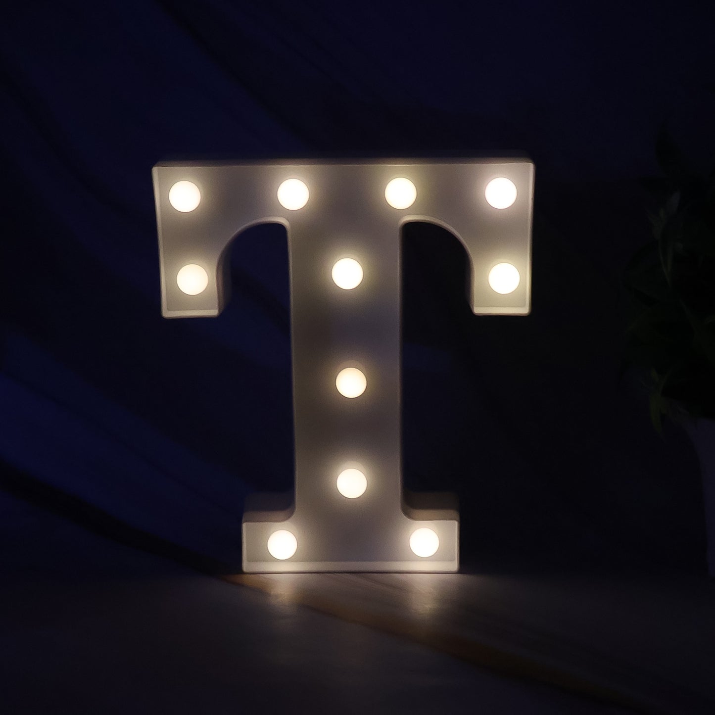 Decorative LED marquee alphabet letter T light by Wukusy, perfect for home decor, illuminated letter with a warm glow.