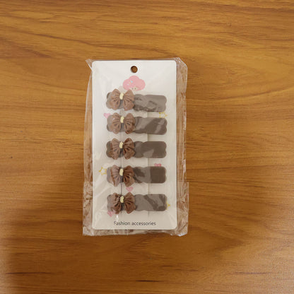 Set of five Wukusy elegant hair clips featuring bow designs, perfect for adding a decorative touch to hairstyles.