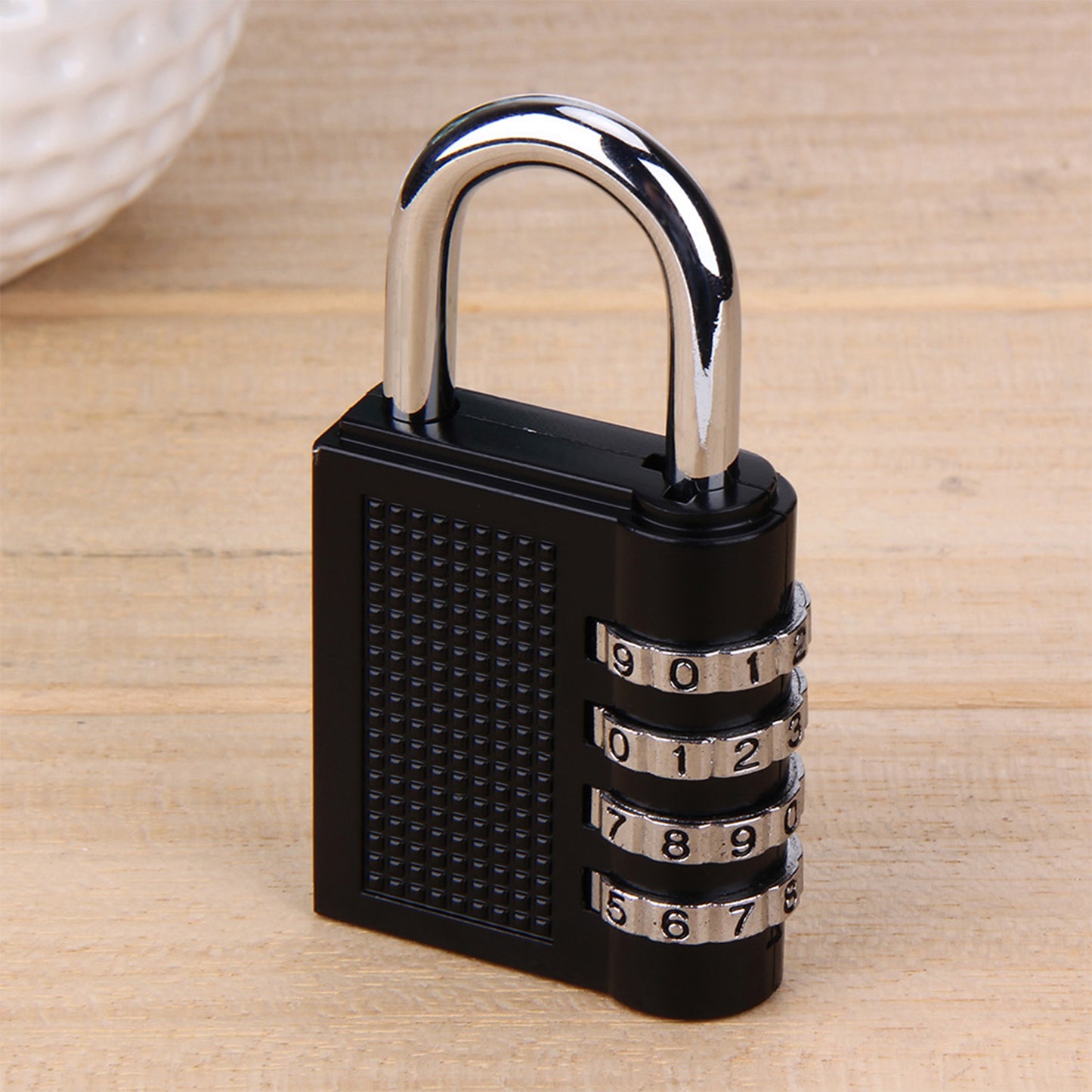 Wukusy 0218a security pad lock with a 4-digit combination, featuring a sturdy metal body and adjustable shackle.