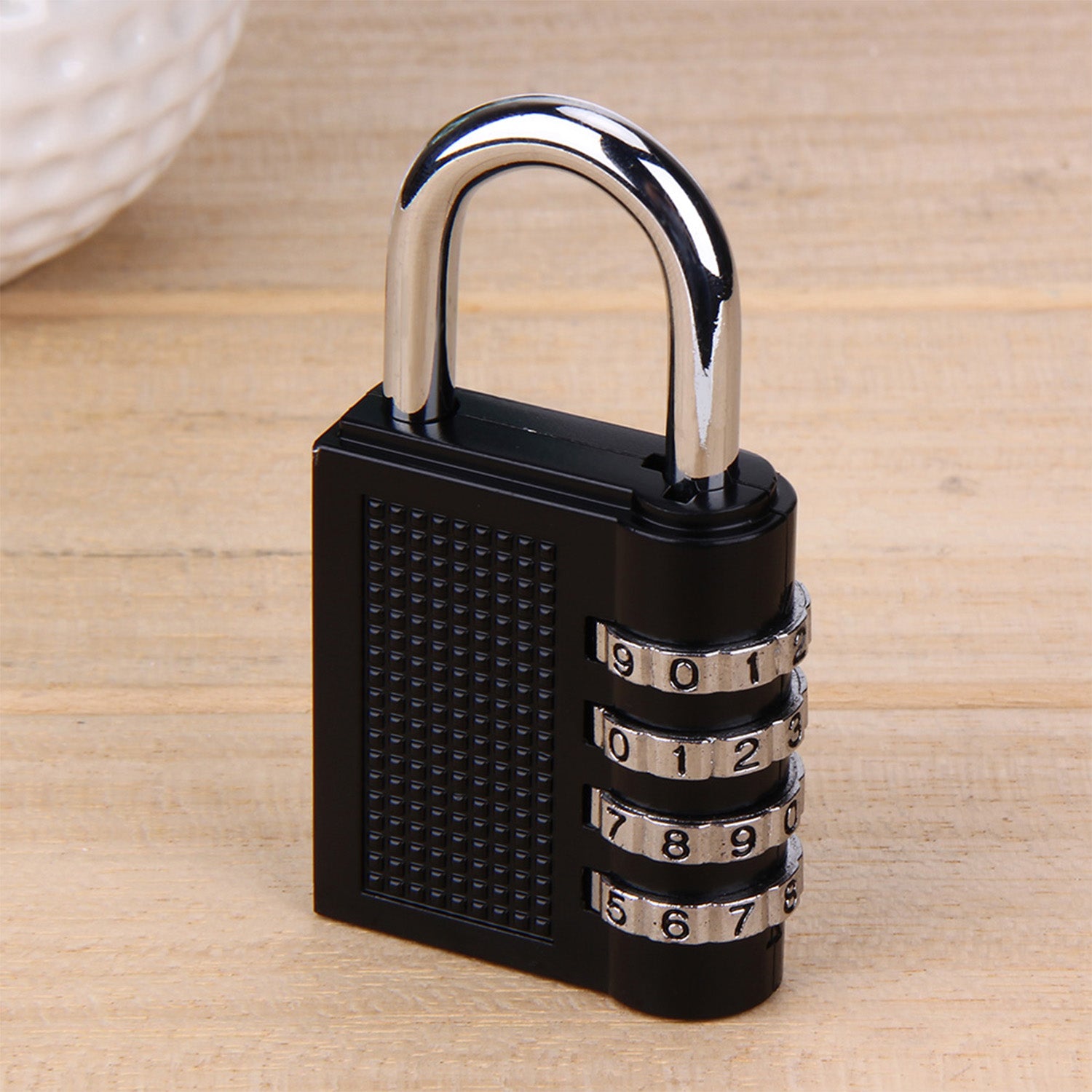 Wukusy 0218a security pad lock with a 4-digit combination, featuring a sturdy metal body and adjustable shackle.