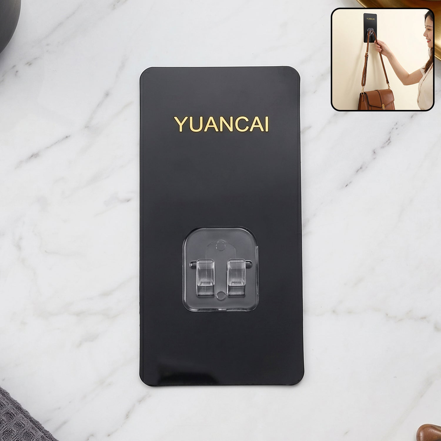 Wukusy adhesive plastic wall hook with strong hold, self-stick hanger for storage, mounted on a wall in a home setting