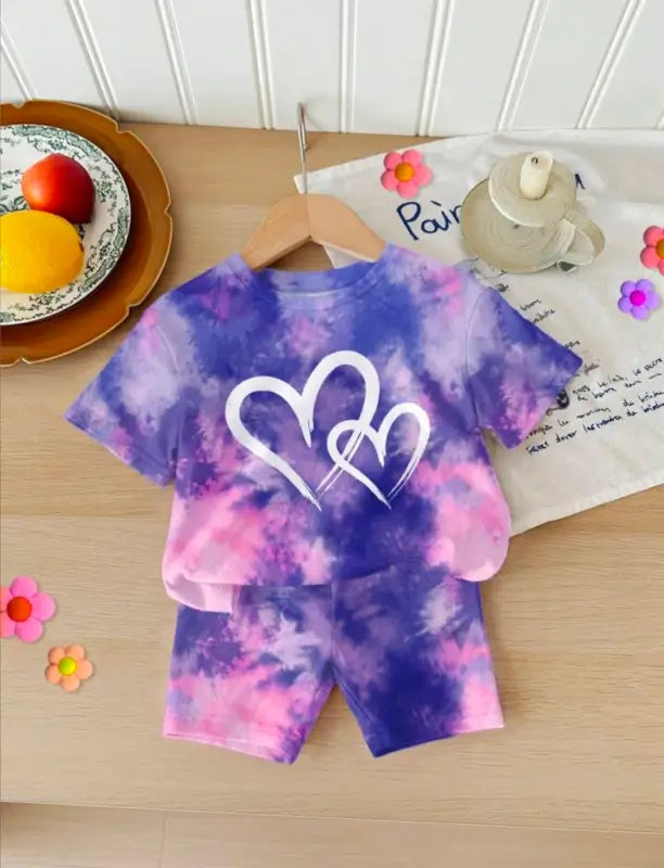 Kids tie-dye heart print summer set from ekom featuring purple and pink tie-dye t-shirt and matching shorts, perfect for warm days.