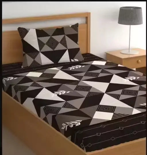 Ekom single bed cotton bedsheet with geometric print and matching pillow cover, ideal for summer use, showcasing soft fabric and stylish design.