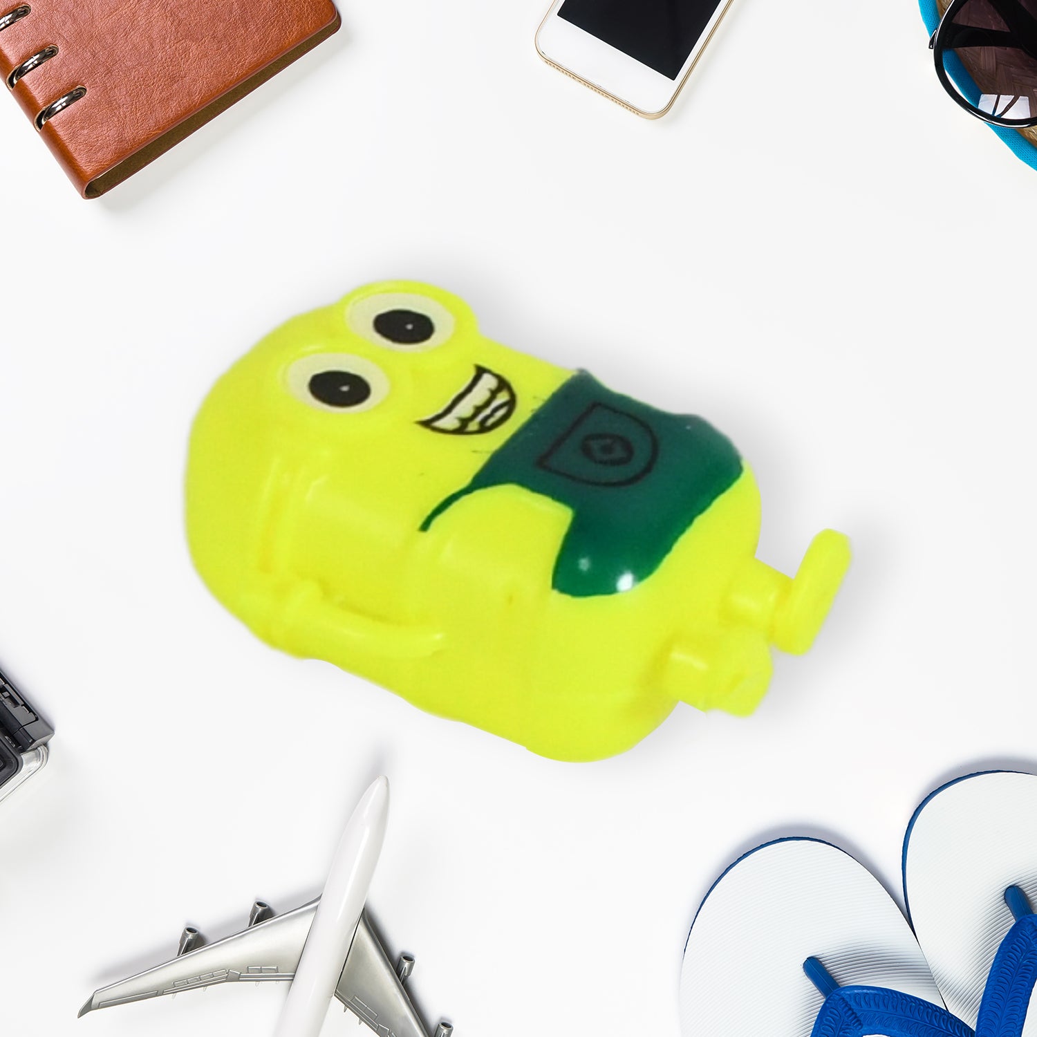 Small green Wukusy Minion toy for kids, featuring a cute, small-sized Minion character with playful details.