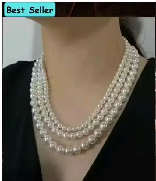 Elegant off-white pearl necklace with multiple layers by Ekom, women's fashion jewelry featuring delicate pearl strands.