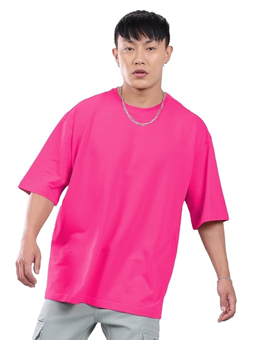 Men's oversized pink T-shirt by Seasons with a relaxed fit, soft fabric, and casual style, shown on a model.