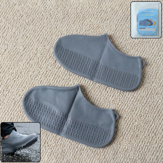 Pair of grey waterproof silicone shoe covers by Wukusy, medium size, protecting shoes from water and dirt.