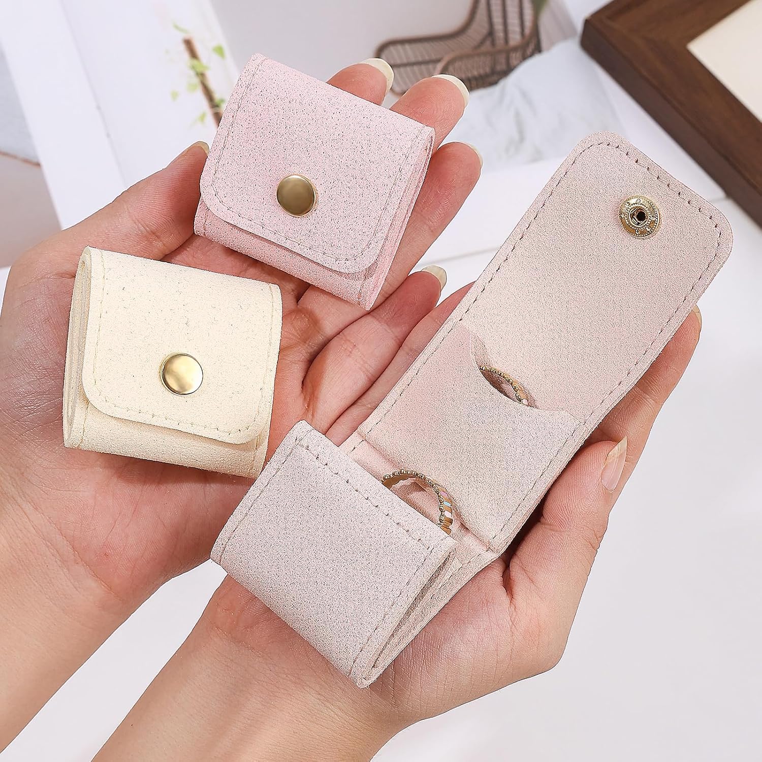 Wukusy compact foldable jewelry storage pouch and wallet, open to show interior compartments for jewelry organization.