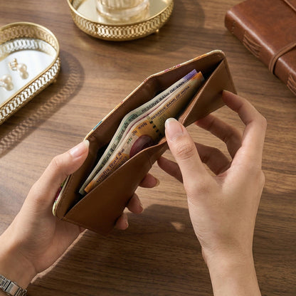 Wukusy premium stylish compact foldable wallet open showing card slots and cash compartment. Black leather design.
