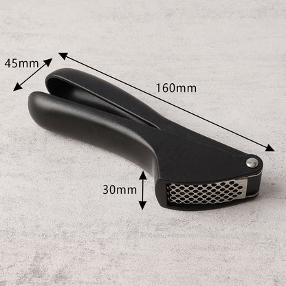 Wukusy manual garlic press crusher tool showing stainless steel body and handle for easy garlic mincing in the kitchen.