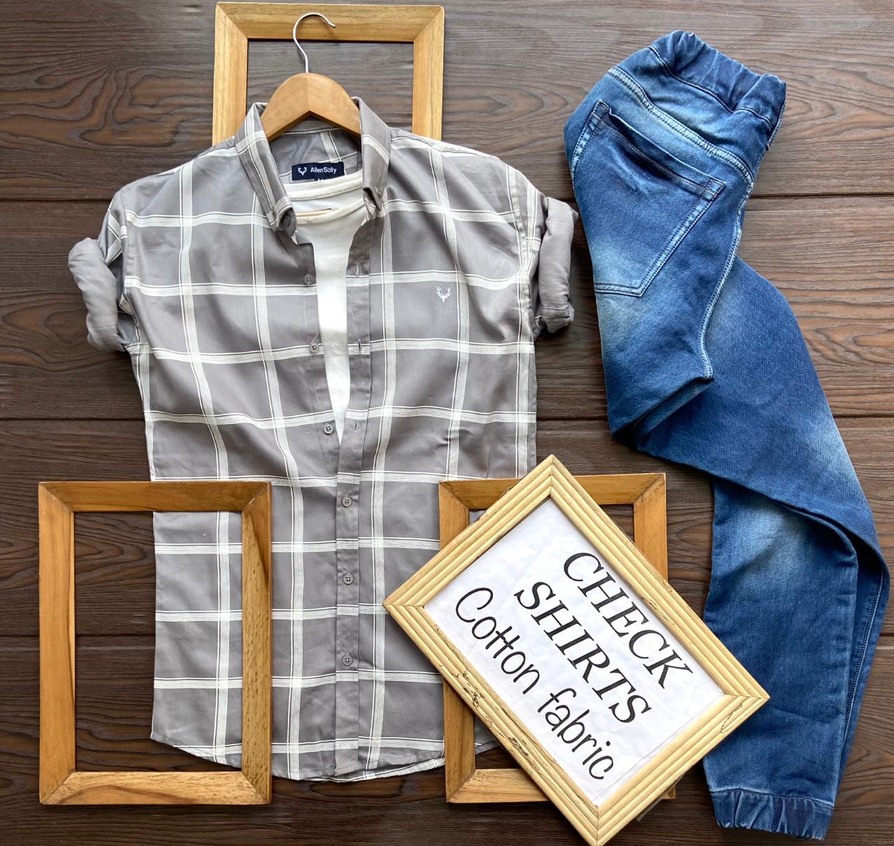 Season's trendy men's grey full-sleeve shirt displayed on a hanger, featuring a classic collar and button-up front.