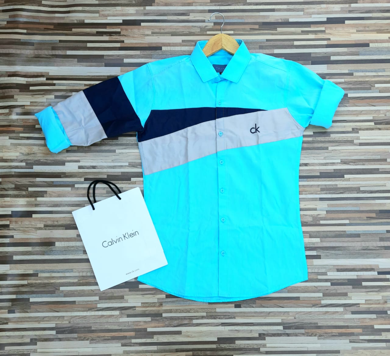 Blue twill straight shirt for men by Seasons, featuring a classic design with a collar and button-front, perfect for casual or formal wear.