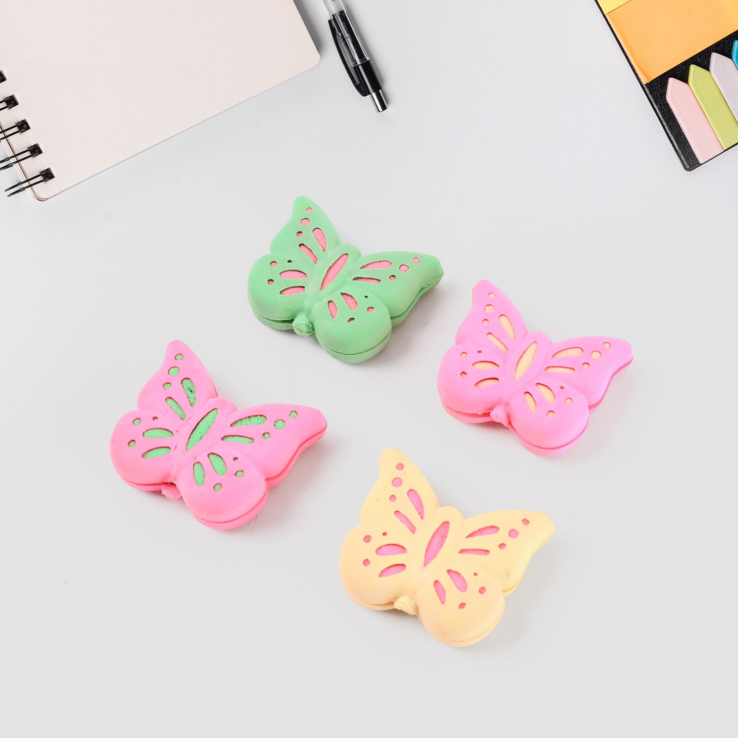Set of 25 colorful butterfly-shaped rubber erasers by Wukusy, perfect for office or school use, featuring mixed vibrant designs.