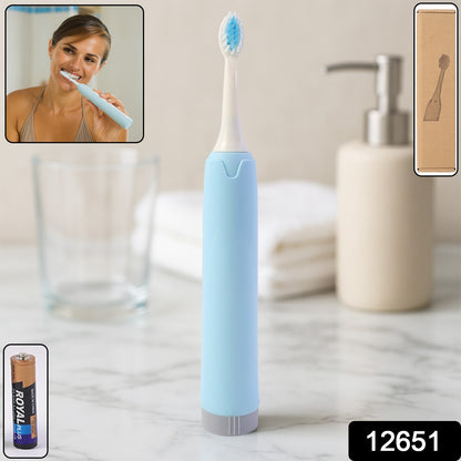 Wukusy portable battery-operated electric toothbrush with white handle and brush head, ideal for travel and everyday dental care.
