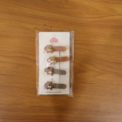 Set of four cute teddy bear decorative hair clips by Wukusy, featuring adorable bear designs for hair accessories.