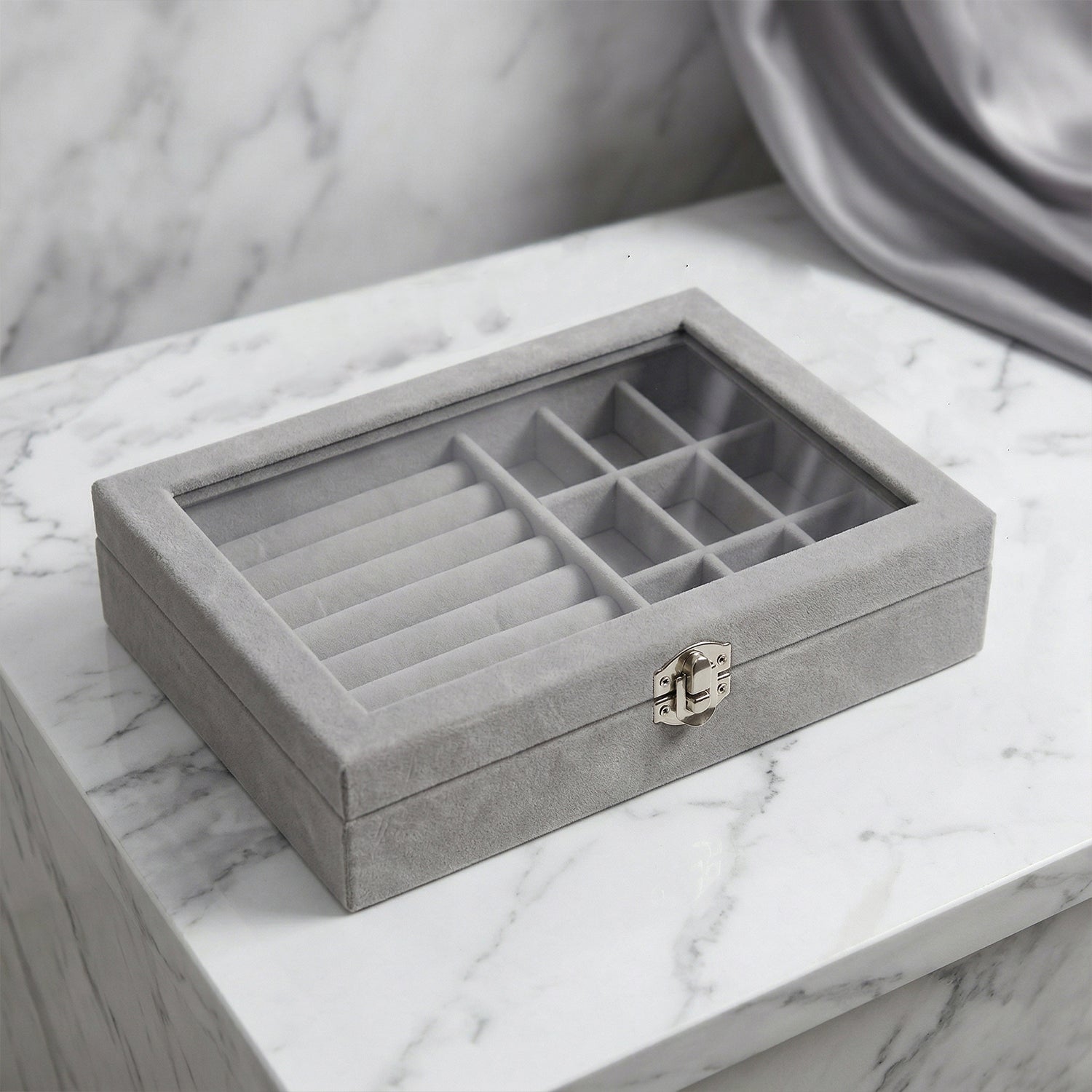 Wukusy premium velvet jewelry organizer box with transparent lid, showcasing compartments for necklaces, rings, and earrings.