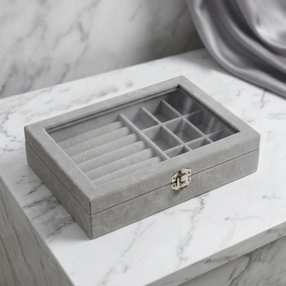 Wukusy premium velvet jewelry organizer box with transparent lid, showcasing compartments for necklaces, rings, and earrings.