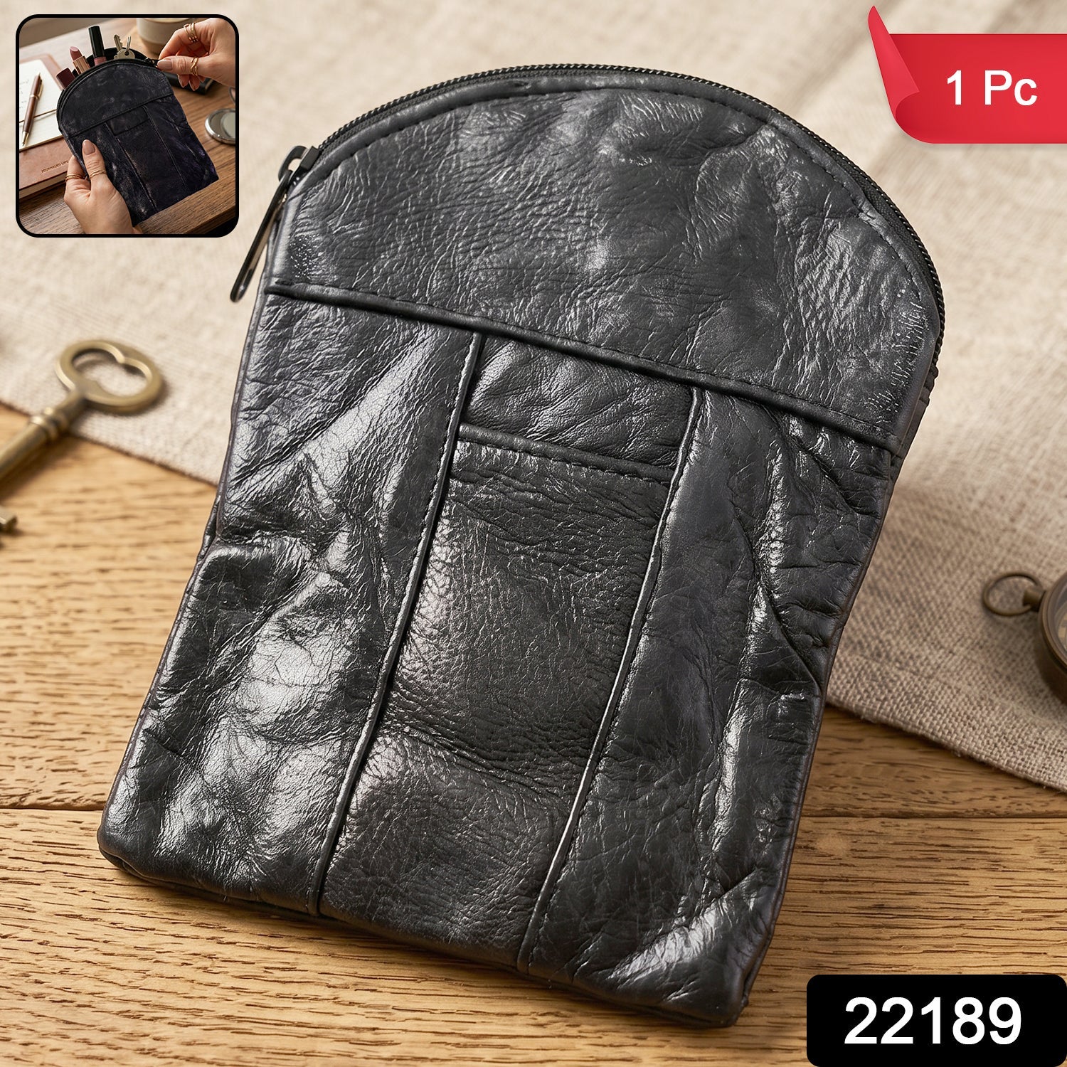 Leather mini zipper pouch by Wukusy, compact coin and card organizer for men and women, with a sleek zipper closure.