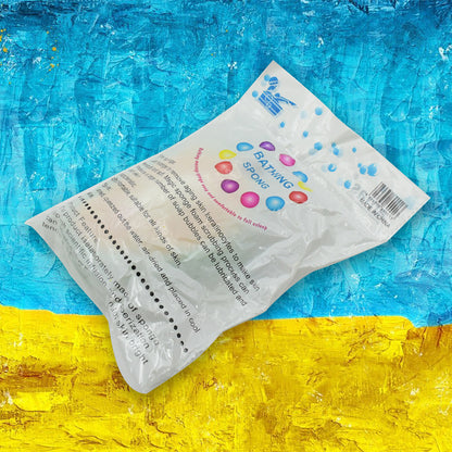 Wukusy mango-shaped kitchen cleaning sponge for dishwashing and bathing, featuring a bright yellow mango design.