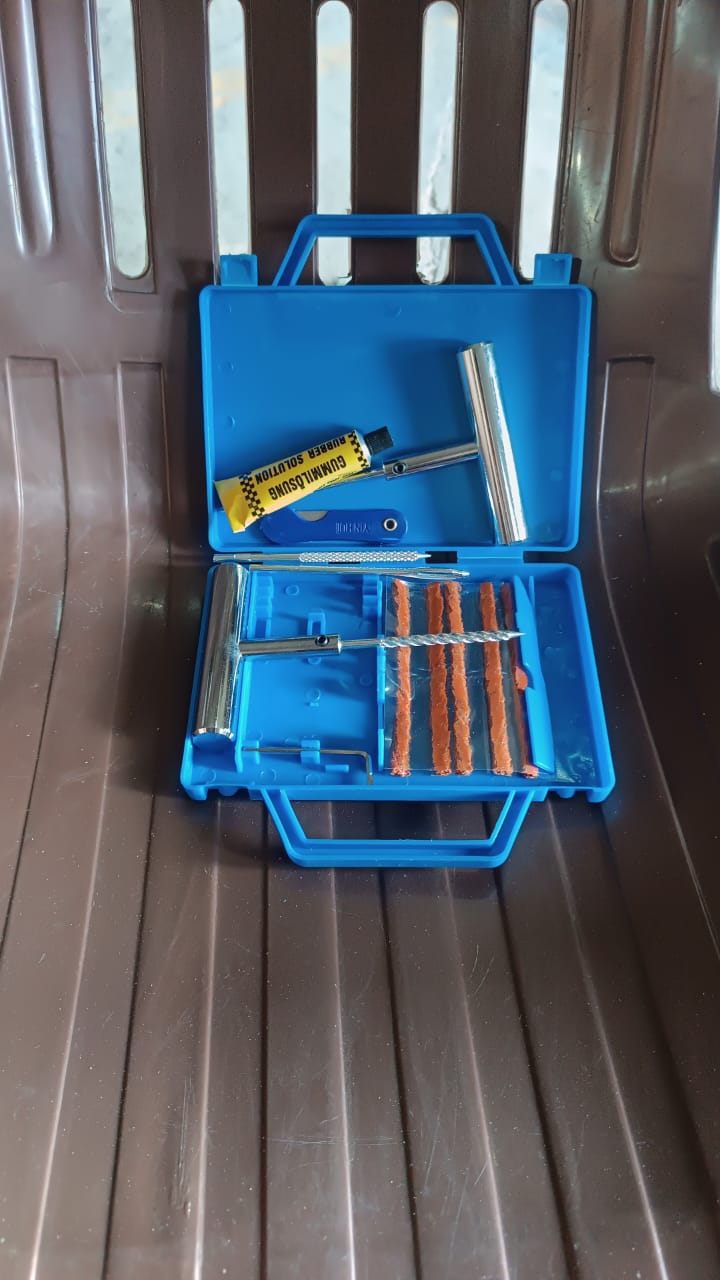 Wukusy portable tire repair kit with 13-piece tyre repairing tools inside a compact box, ideal for emergency tire fixes.