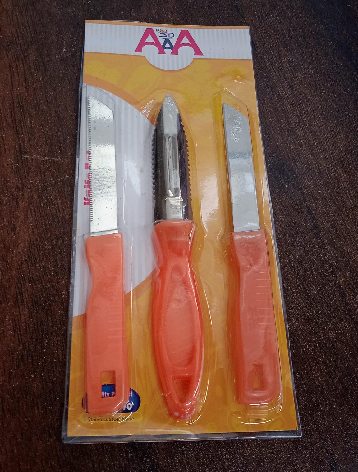 Wukusy 3-in-1 stainless steel kitchen knife set with plain, vegetable peeler, and utility knife for chopping, peeling, and slicing.