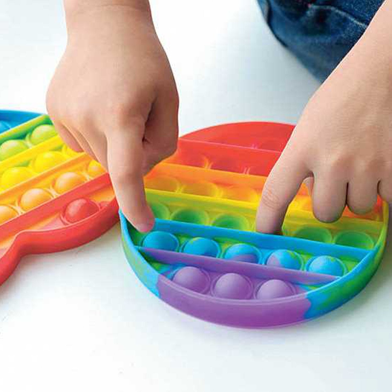 Wukusy rainbow-colored fidget toy with random shapes, made of soft silicone for stress relief and sensory play.