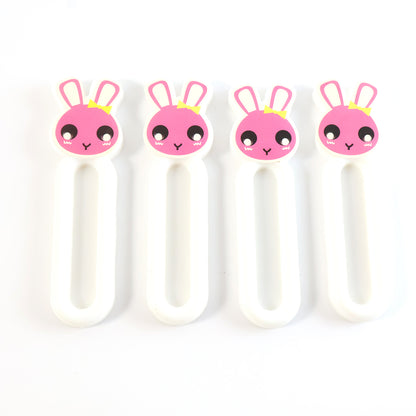 Set of four Wukusy Self Stick Push Pull Helpers for easier door and drawer operation in home and kitchen settings.