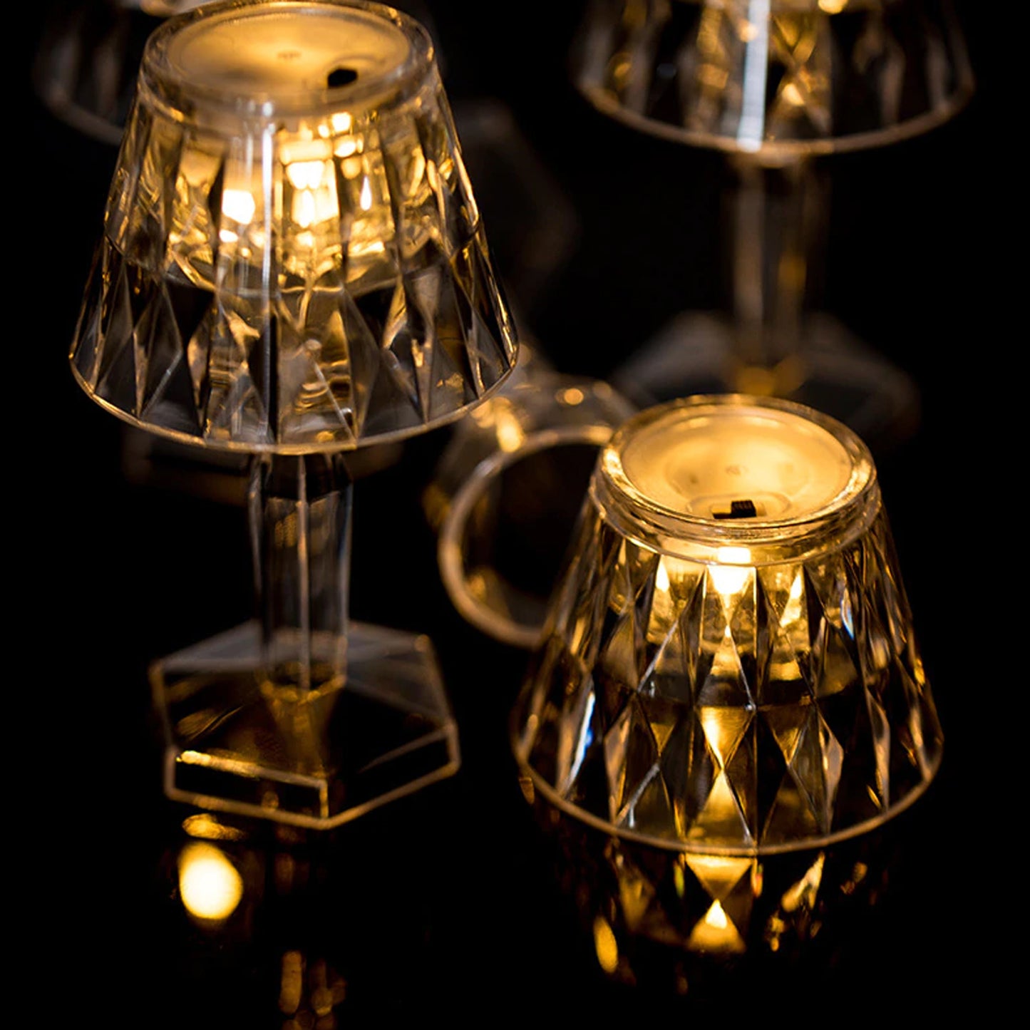 Wukusy 6610 2-in-1 transparent mini crystal table lamp with reflection light, showcasing a sleek modern design and glowing crystal accents.