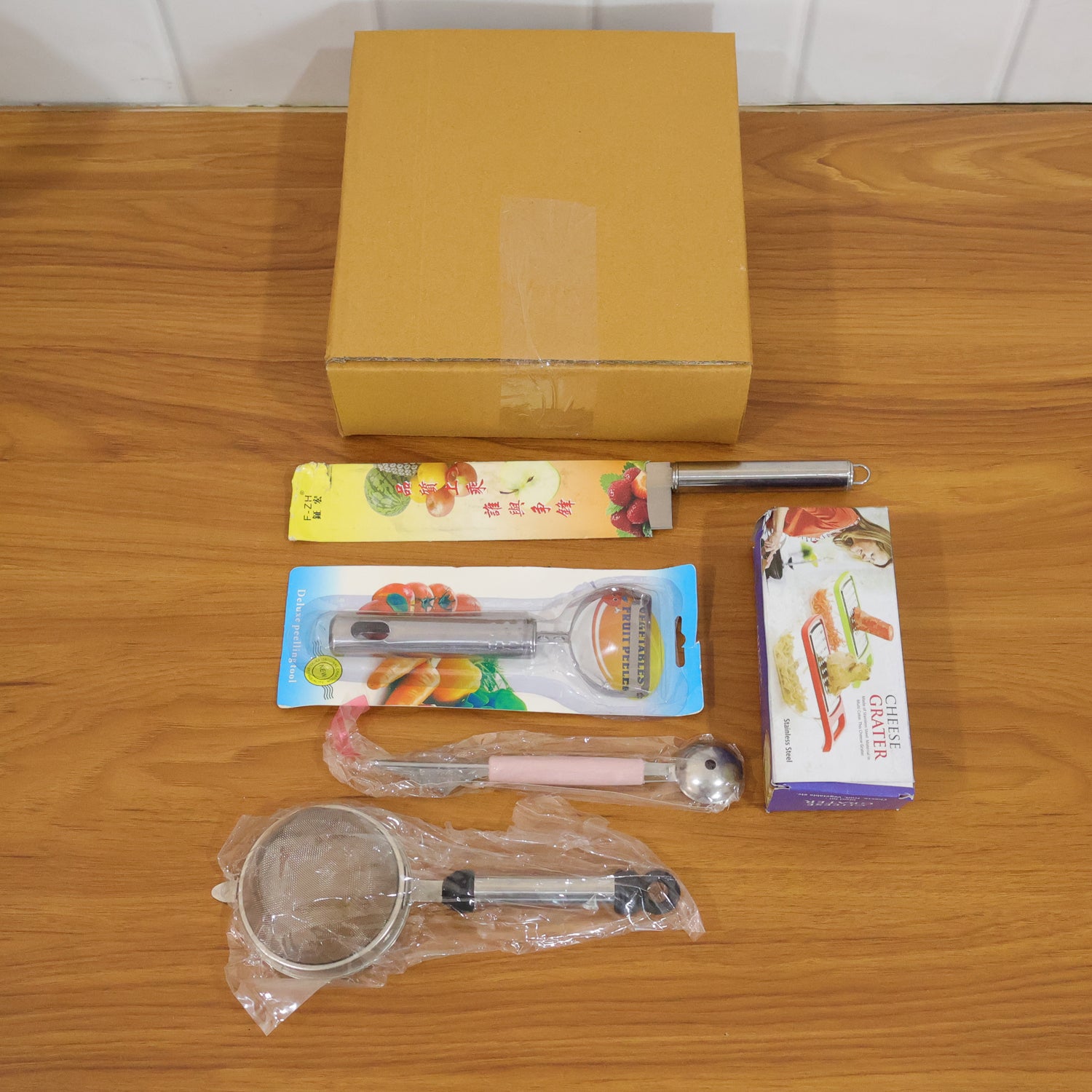 Wukusy 5-in-1 multipurpose kitchen tool set with various utensils for cooking, slicing, and food preparation.