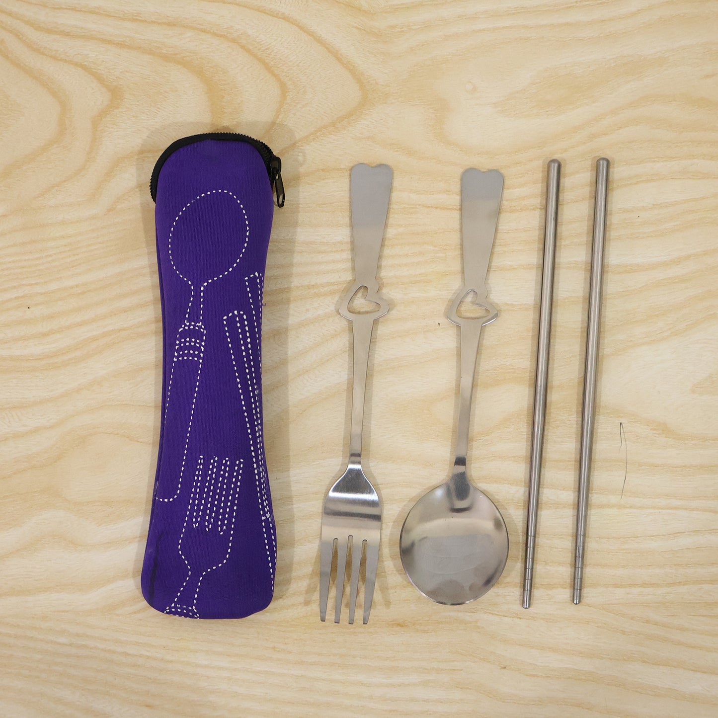 Wukusy portable stainless steel cutlery set with spoon, fork, chopsticks, and pouch for travel and outdoor dining.